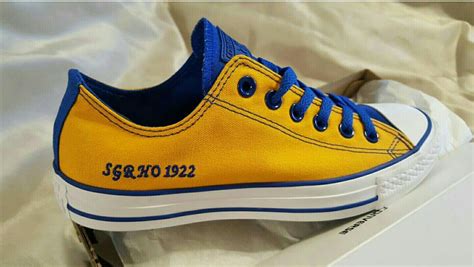 blue and gold tennis shoes